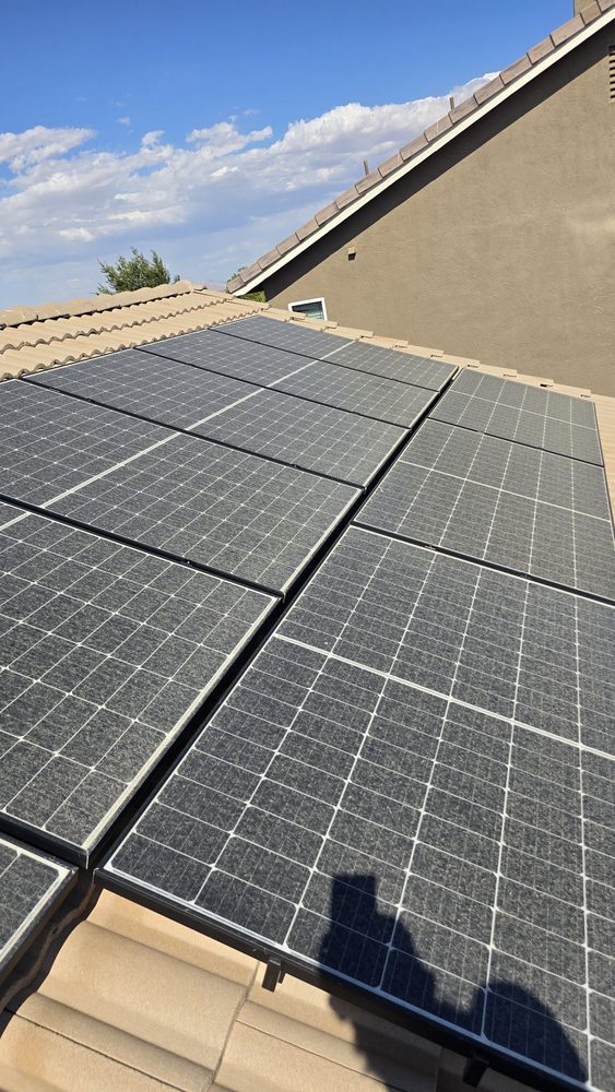 Solar panels greyed over with dust, before cleaning